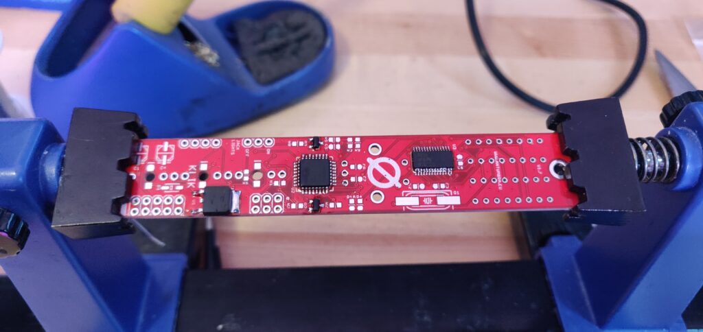 KLIK PCB on a PCB holder with the ICs soldered